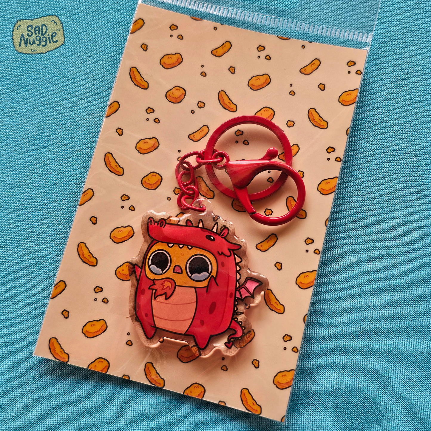 Sad Nuggie Dragon Epoxy Keychain