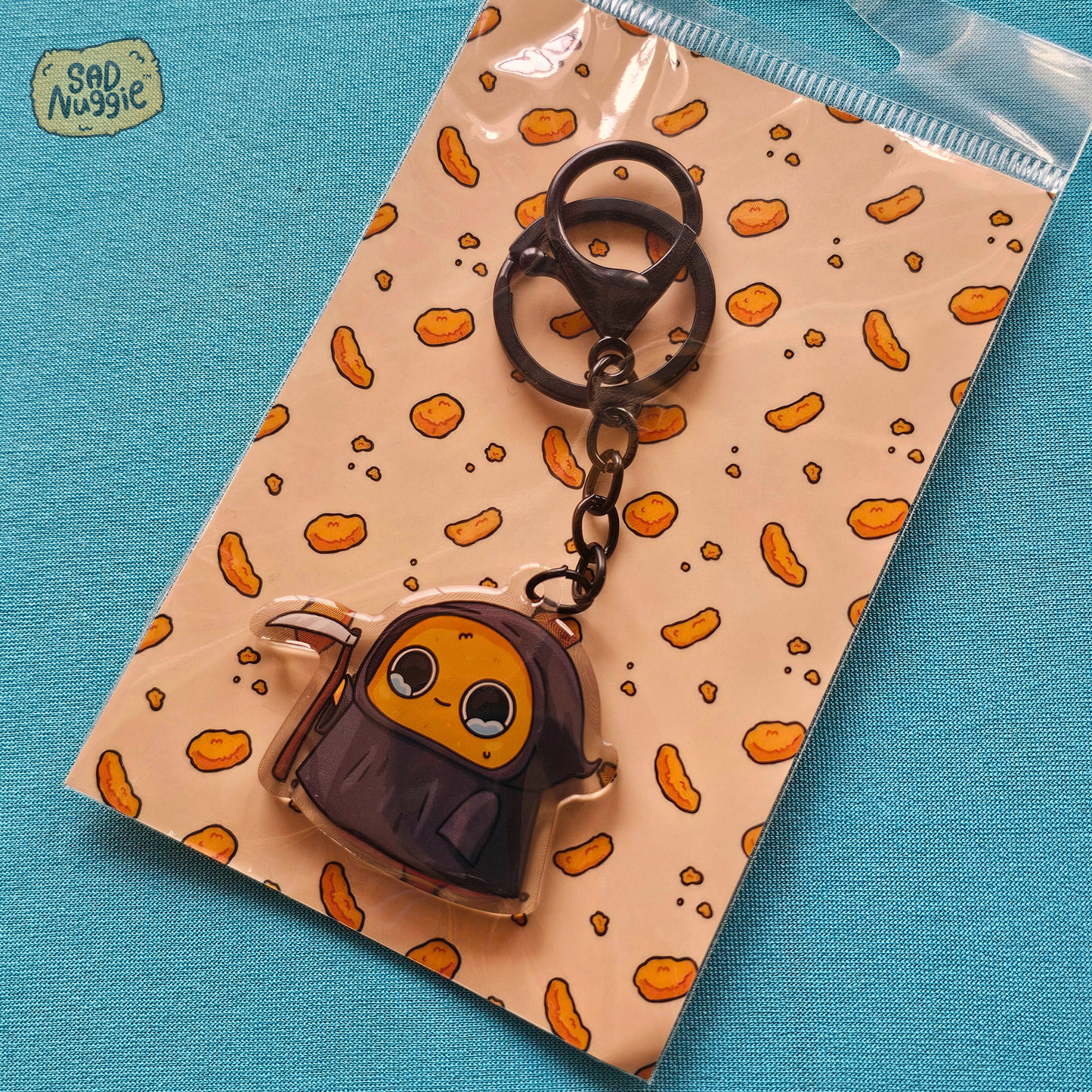 Sad Nuggie Grim Reaper Epoxy Keychain