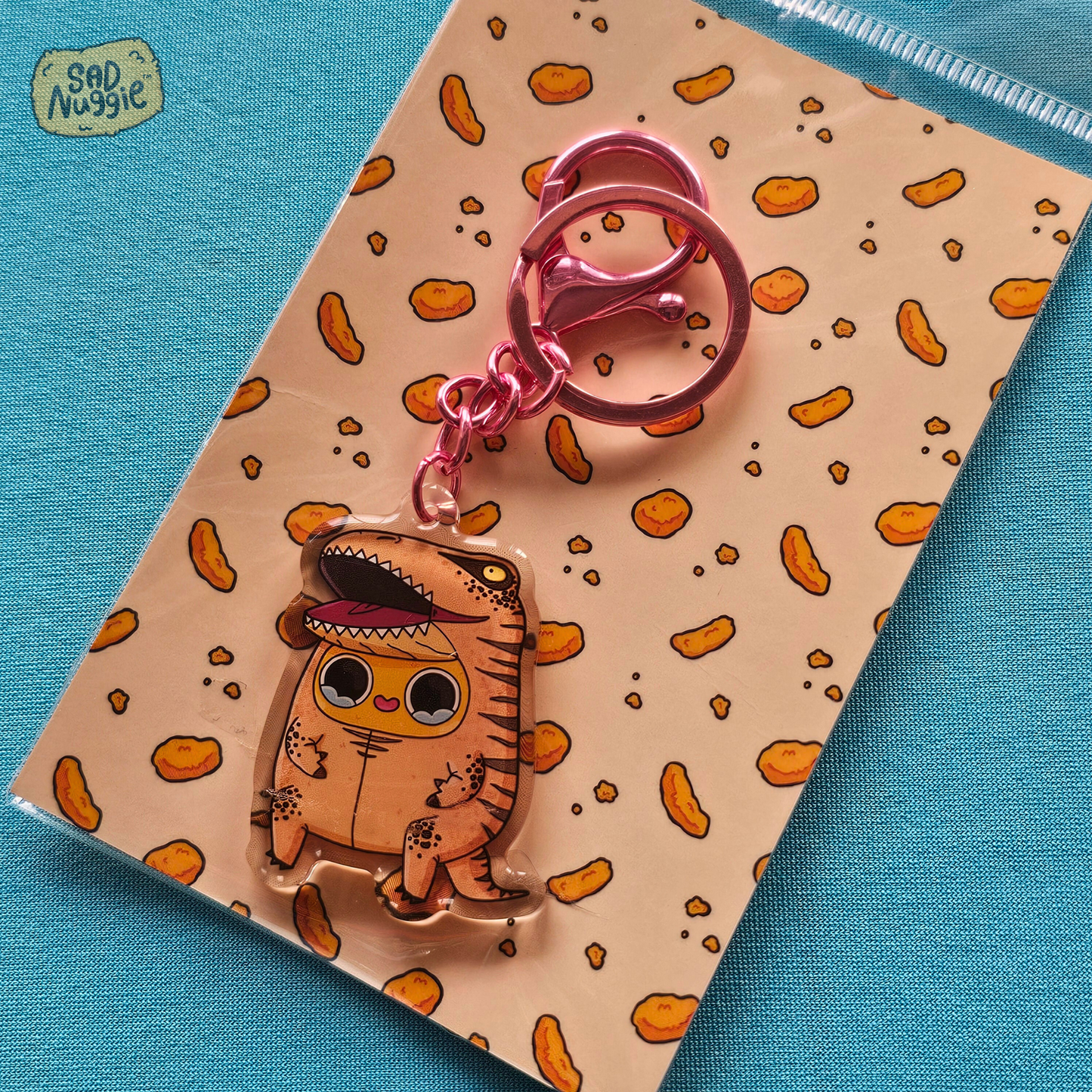 Sad Nuggie Inflatable Dino Epoxy Keychain