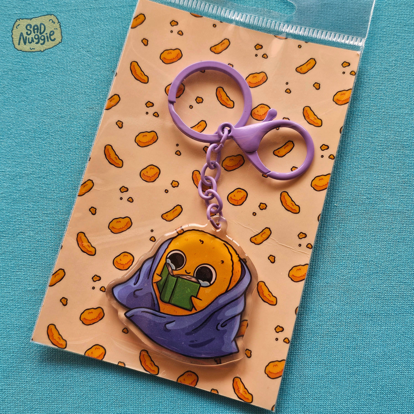 Sad Nuggie Reading Epoxy Keychain