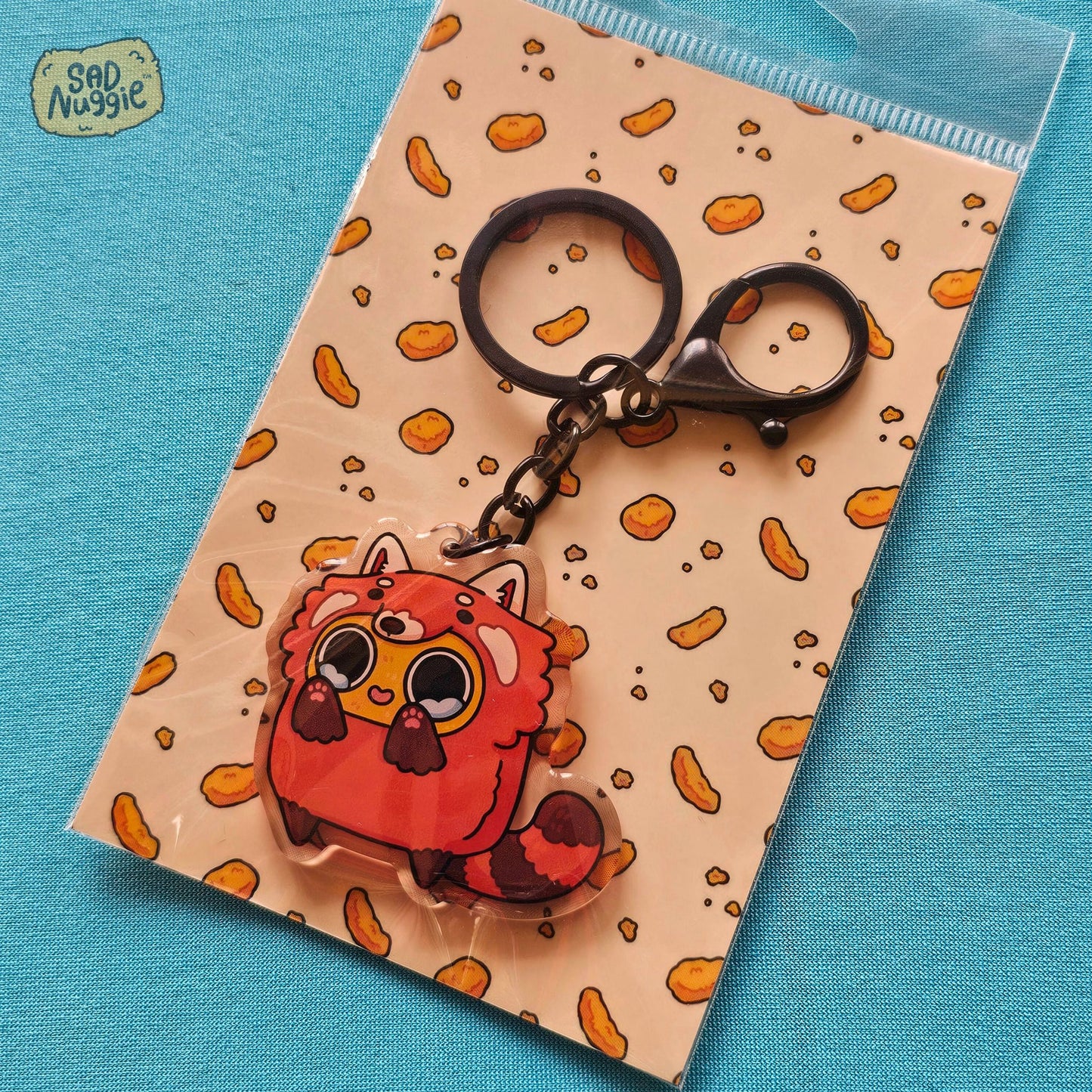 Sad Nuggie Red Panda Epoxy Keychain