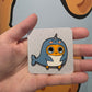 Sad Nuggie Narwhal Enamel Pin