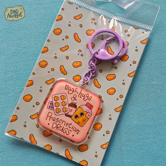Sad Nuggie Nugs, Hugs, & Prescription Drugs Epoxy Keychain