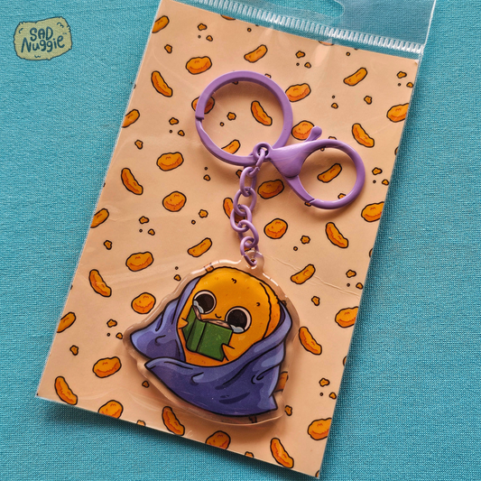 Sad Nuggie Reading Epoxy Keychain
